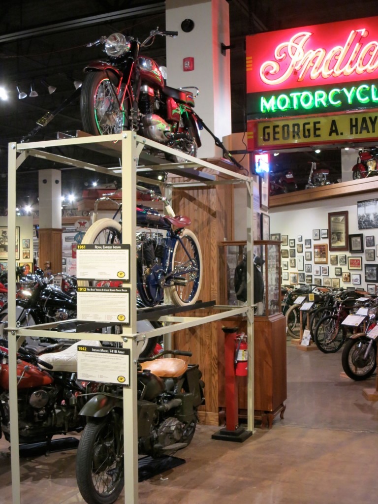 Advertising graphics and signage include this great original neon sign. The three high display includes an Indian Matchless single, a 1912 "Big Base" twin racer and a 741 Military Indian.